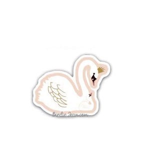 May include: A white swan with a pink outline and a gold crown, holding a smaller white swan with a pink outline. The swan is looking to the right. The text "Birdie Jean.com" is below the swan.