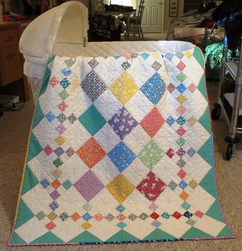 It's a great way to use 5" x 5" charms to make this cozy baby quilt.