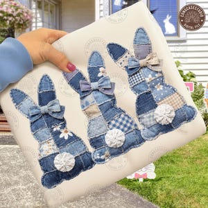 May include: Three denim patchwork bunny figures with bow ties and fluffy white tails. The bunnies are made from various shades of blue denim fabric and are arranged on a cream-colored background. The image has the text "CONGCASESTUDIO DIGITAL FILE".