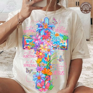 May include: A white ceramic mug with a black handle and the text "But First, Coffee" in a bold, black font. The mug is set against a blurred background, highlighting its clean design.