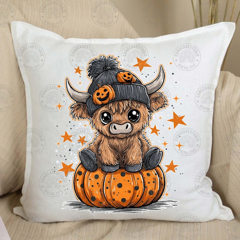 May include: A decorative pillow featuring a cartoon Highland cow wearing a gray beanie with pumpkin accents. The cow is sitting on a large orange pumpkin with black spots, surrounded by orange stars. The pillow has the text "CONGCASESTUDIO" on it.
