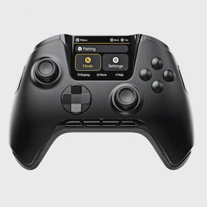 May include: A black games controller with a small screen displaying menu options. The controller has two analogue sticks, a directional pad, and several buttons. The screen shows options for pairing, mode, and settings.
