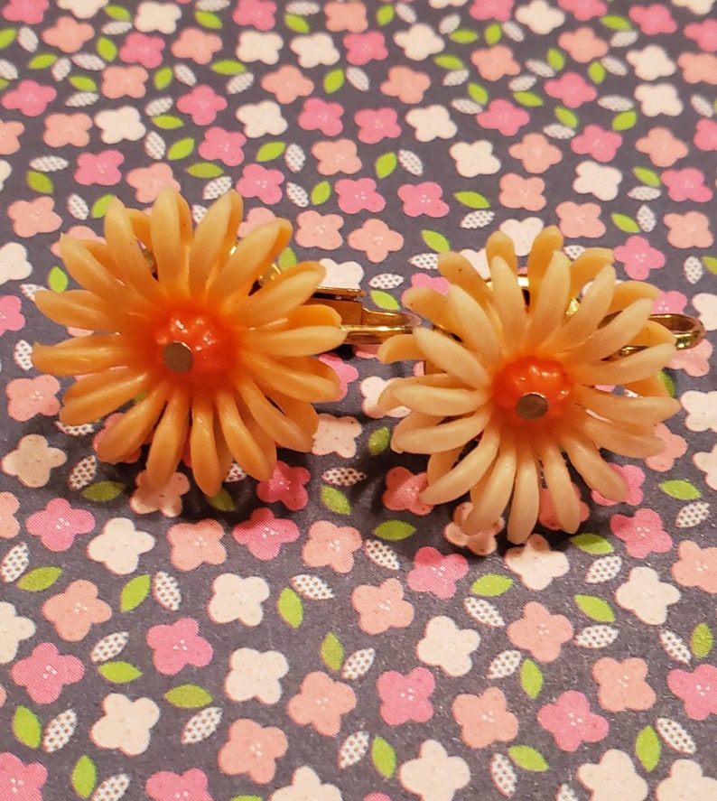 Clip earrings, sunny orange plastic flowers, small image 1