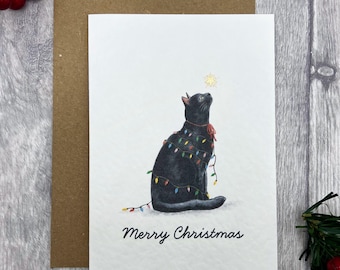 Cute Black Cat Christmas Card A6 — Funny Black Cat Wrapped in Lights | Blank Festive Cat Lover Card with Gold Star