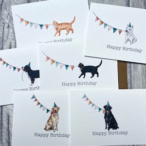 May include: Five different greeting cards featuring a variety of animals wearing party hats and pulling on a string of colourful bunting. The text on the cards reads "Happy Birthday".