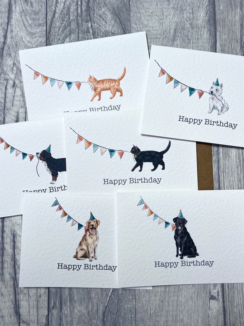 May include: Five different greeting cards featuring a variety of animals wearing party hats and pulling on a string of colourful bunting. The text on the cards reads "Happy Birthday".