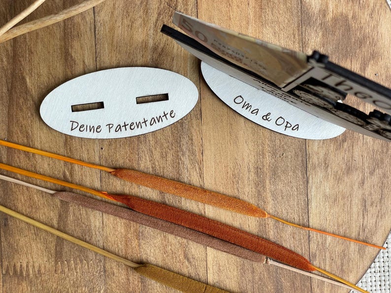 May include: Two wooden signs with slots for money. The sign on the left says "Deine Patentante" and the sign on the right says "Oma & Opa".