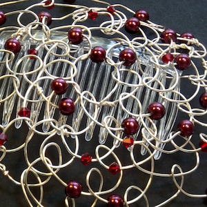 Burgundy pearls and siam swarovski crystal beads are wire wrapped into loops for a women's kippah or yarmulke.