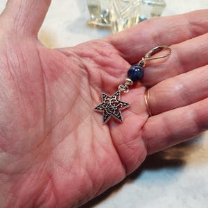 Image is of a leverback Star of David charm earring with sodalite gemstones and silver spacers.