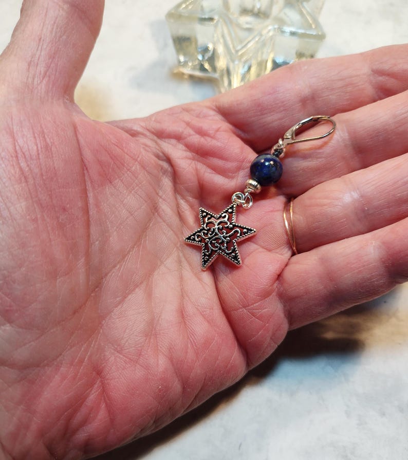Image is of a leverback Star of David charm earring with sodalite gemstones and silver spacers.