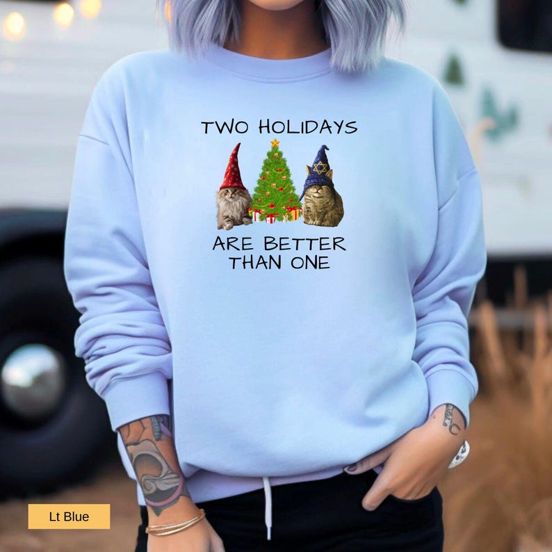 Two Holidays are better than one Cat Lovers Christmas and Hanukkah sweatshirt in light blue designed by LinorStore Designs