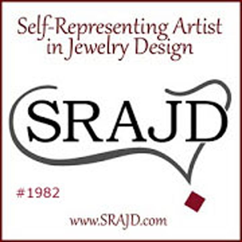 May include: A white background features the text "Self-Representing Artist in Jewelry Design" in burgundy. The logo "SRAJ D" is in black, with a stylized grey line. Below is "#1982" and the website address www.SRAJ D.com.
