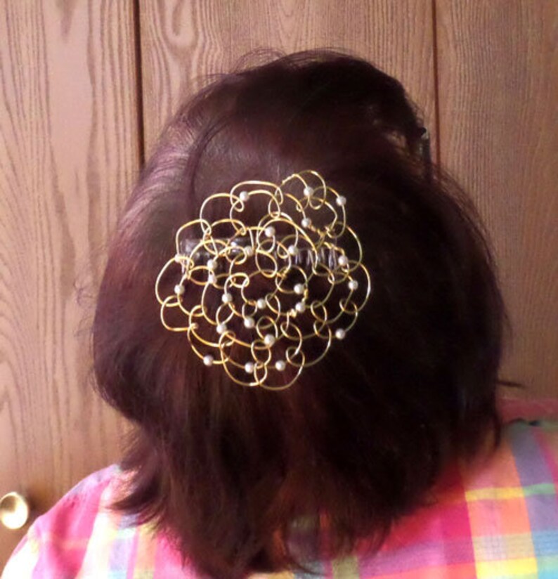A sample kippah with small, white glass pearl beads shown on the back of my head.