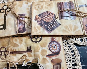 Juego de 4 sobres decorados a mano con temática Steampunk para diarios y libros.