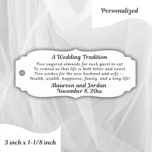 May include: A white personalized wedding favor tag with the text "A Wedding Tradition" and a message about sugared almonds. The tag is 3 inches by 1-1/8 inches and includes the names Maureen and Jordan and the date November 8, 20xx.