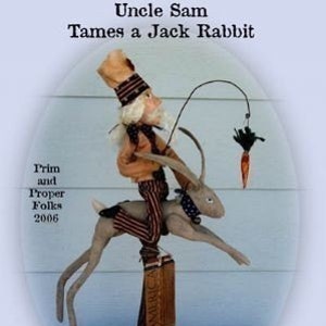 May include: A folk art figurine of Uncle Sam riding a jackrabbit, holding a carrot on a fishing line. The figurine is on a wooden base with the word "America" visible. The text "Uncle Sam Tames a Jack Rabbit" is above the figurine.