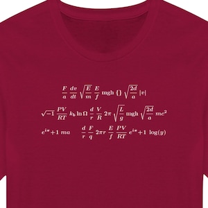 May include: A maroon t-shirt with a white print of various physics equations. The equations include the following: F de/a dt, E/m, mgh, 2d/a, PV/kT, k ln(1), d/r, 2г, mgh, 2d/a, me², e**+1 ma, d/r, 2гr, E/PV, e**+1 log(y).