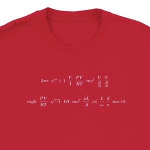 May include: A red t-shirt featuring white mathematical formulas. The equations are arranged across the front of the shirt, with various symbols and letters. The shirt is made of a soft material.
