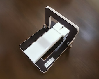 May include: A wooden frame with a white plastic insert. The frame has a black background and the text "MILLERS BUILD-IT-YOUR-SELF" is printed on the bottom.