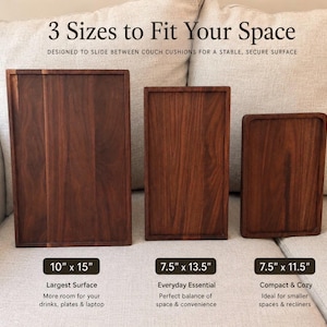 May include: Three rectangular dark wood trays in varying sizes. Text reads: 3 Sizes to Fit Your Space, 10" x 15", 7.5" x 13.5", and 7.5" x 11.5". The trays have raised edges and a smooth finish, designed to sit on furniture surfaces.
