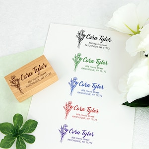 May include: Five different versions of a return address stamp with a floral design. The stamp reads "Cora Tyler" with the address "806 Harris Street, PATCHOGUE, NY 11772". The stamps are printed in green, blue, red, purple, and brown ink.