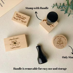 May include: A collection of wooden stamps with black handles. The stamps feature various designs and text, including "Better Love Company," "From the Library of Sarah Quigley," and personalized library stamps. The handle is removable for easy use and storage.