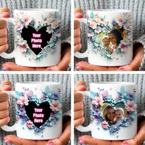May include: White ceramic mug with a heart-shaped design featuring a floral pattern in shades of pink, blue, and green. The heart has a cutout where you can add your own photo. The text "Your Photo Here" is written in pink inside the heart.