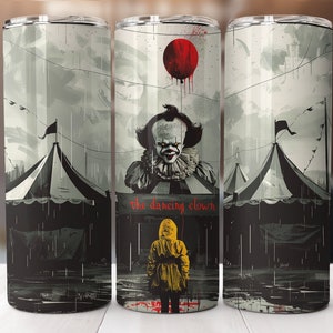 May include: A stainless steel tumbler with a black and white illustration of Pennywise the Dancing Clown from the movie "IT". The image features a red balloon, a circus tent, and the text "The Dancing Clown".
