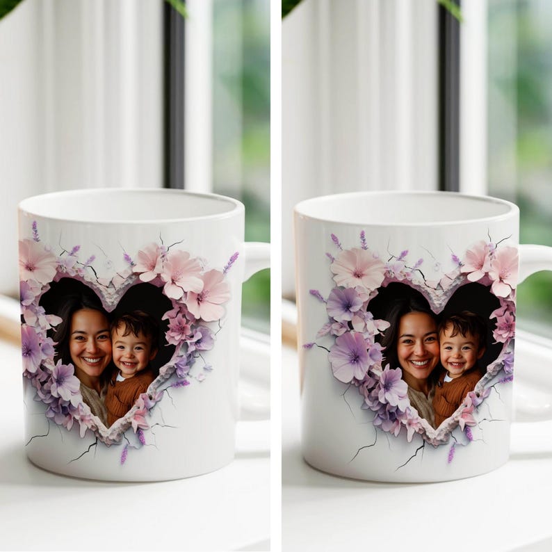 May include: White ceramic mug with a heart-shaped design featuring a photo of a mother and child. The heart is surrounded by pink and purple flowers.