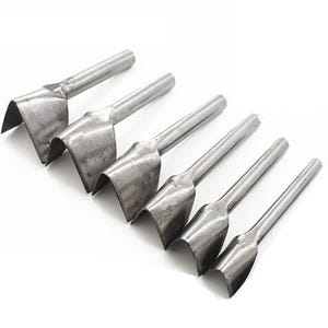 May include: A white ceramic mug with a black handle and the text "But First, Coffee" in a handwritten style. The mug is on a white surface. The mug is approximately 4 inches tall.