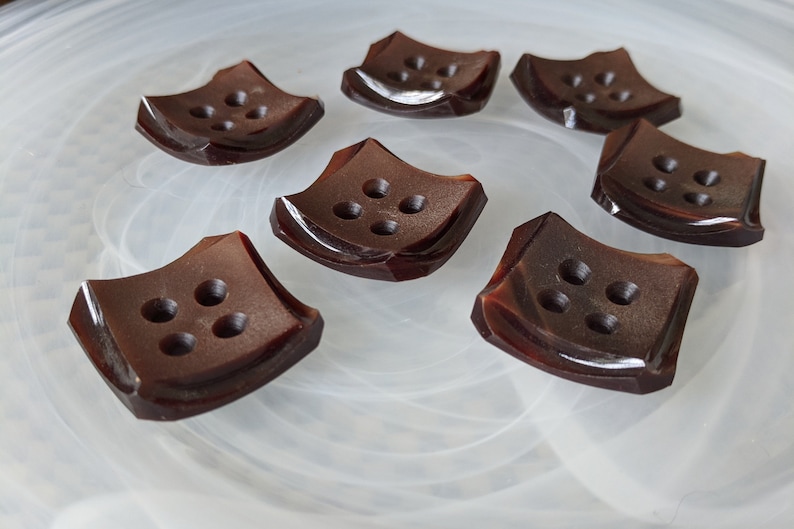 Seven Brown Square Plastic Buttons