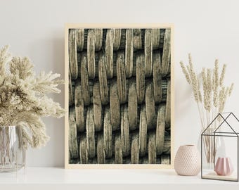 May include: A framed print featuring a close-up of a woven texture in shades of beige and gray. The artwork is displayed on a white shelf, accompanied by decorative vases and dried plants, creating a natural, minimalist aesthetic.
