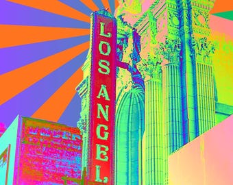 May include: A vibrant, psychedelic image of a building facade with a red sign that reads "LOS ANGELES" in neon green letters. The background features a burst of orange, purple, and blue rays.