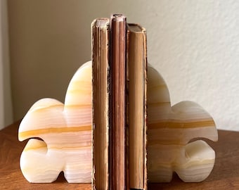 Vintage onyx boekensteunen met fleur-de-lis, gebeeldhouwde stenen boekensteunen, Franse decoratie