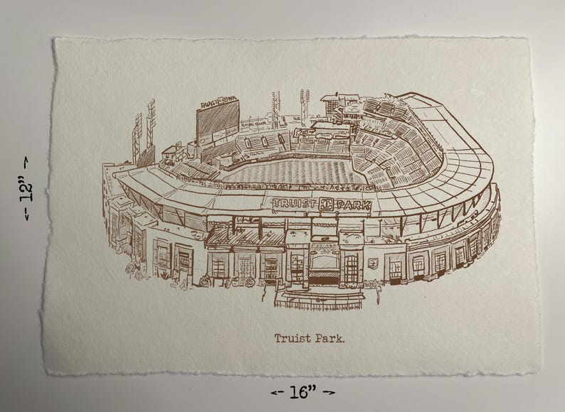 May include: A sepia-toned sketch of Truist Park, a baseball stadium, on textured paper. The artwork is approximately 12 inches by 16 inches. The stadium's architecture is detailed, with the name "Truist Park" visible. The drawing style is reminiscent of an architectural rendering.