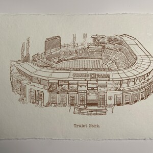 May include: A sepia-toned pen and ink drawing of Truist Park baseball stadium. The detailed illustration shows the stadium's architecture, including the seating, scoreboard, and exterior features. The text "Truist Park" is at the bottom.