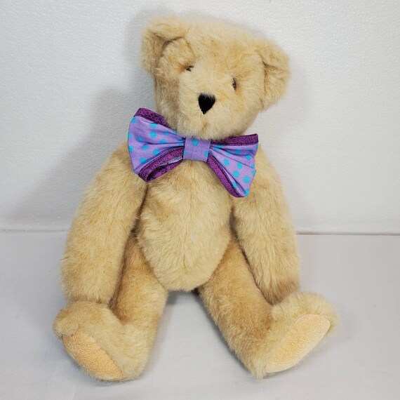 teddy bear with purple bow tie