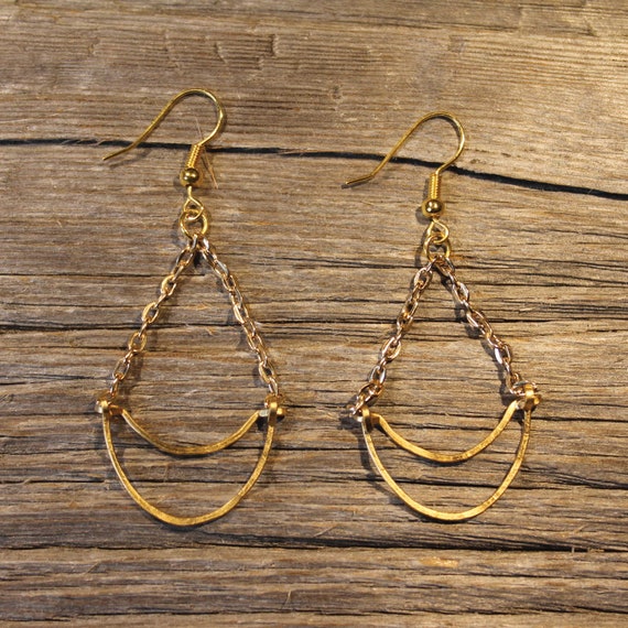 Handmade brass crescent earrings with black fan detailing. Crescent fan earrings