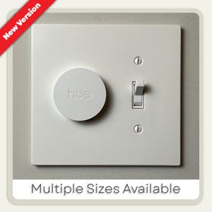 May include: A white light switch with a round dimmer labeled "hue" and a toggle switch. The text "Multiple Sizes Available" is at the bottom. A red banner in the top left corner reads "New Version".