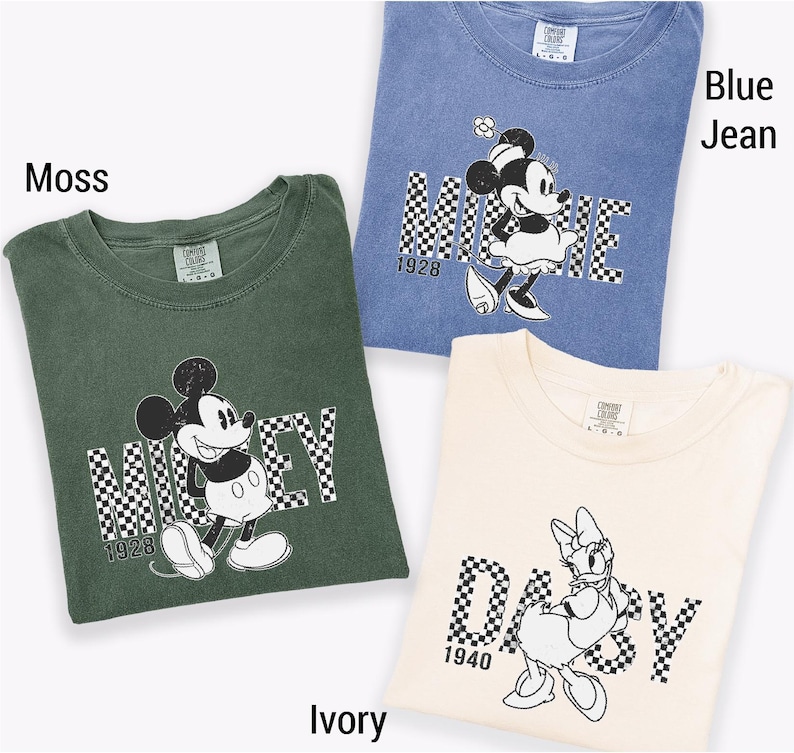 three t-shirts with Disney characters, including Mickey Mouse and Minnie Mouse, printed on them.