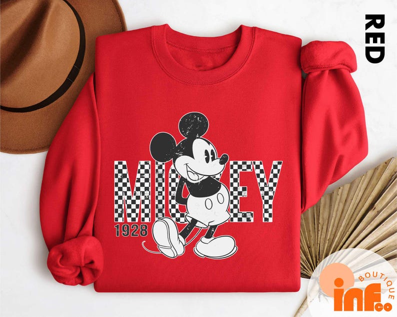 a red shirt with a mickey mouse on it
