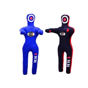 May include: Two martial arts training dummies. One is blue with white detailing, the other is black with red detailing. Both have a target on the head and the word "MMA" printed on the leg.