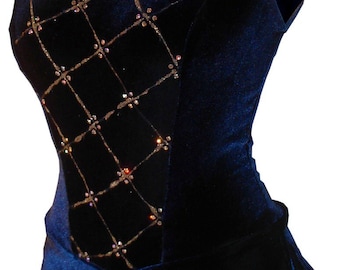 May include: A sleeveless, navy blue velvet dress with a high neckline. The bodice features a diamond pattern with gold stitching and small, iridescent embellishments. The skirt is a simple, flared design.