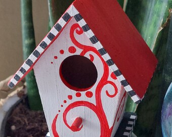 Small decorative painted birdhouse red, white, black checkered