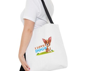 Könnte beinhalten: Weiße Canvas-Tragetasche mit schwarzen Riemen. Die Tasche zeigt ein Cartoon-Bild eines braunen und weißen Hundes mit dem Text "I LOVE DOGS" in blauen und braunen Buchstaben.