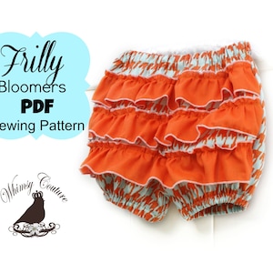 May include: Frilly Bloomers PDF Sewing Pattern. A sewing pattern for frilly bloomers with multiple layers of ruffles. The bloomers are orange with a white and blue patterned fabric.