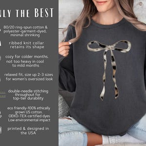 May include: A dark gray sweatshirt with a large, black and white animal print bow on the front. The sweatshirt has a relaxed fit and is made from a blend of cotton and polyester. The text "ONLY THE BEST" is printed on the left side of the image.