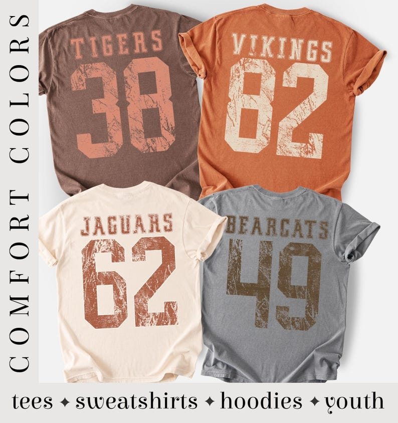 May include: Four t-shirts in various colors, each with a team name and number printed on the back. The shirts are brown, orange, cream, and gray. The text "COMFORT COLORS" is printed vertically on the left side. The bottom of the image reads "tees &bull; sweatshirts &bull; hoodies &bull; youth".