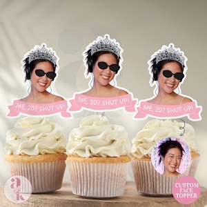 May include: Three cupcakes with white frosting and custom face toppers. Each topper features a woman wearing sunglasses, a tiara, and headphones, with the text "ME, 20? SHUT UP!" on a pink banner. One cupcake has a "CUSTOM FACE TOPPER" label.