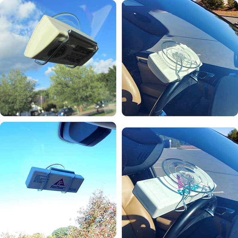 Puede incluir: Un soporte de parabrisas de coche blanco con una ventosa y un clip de metal. El soporte sostiene un dispositivo blanco con el texto "FastTrac" en &eacute;l.
